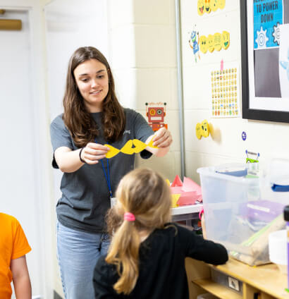 LeafSpring School teacher doing crafts with students